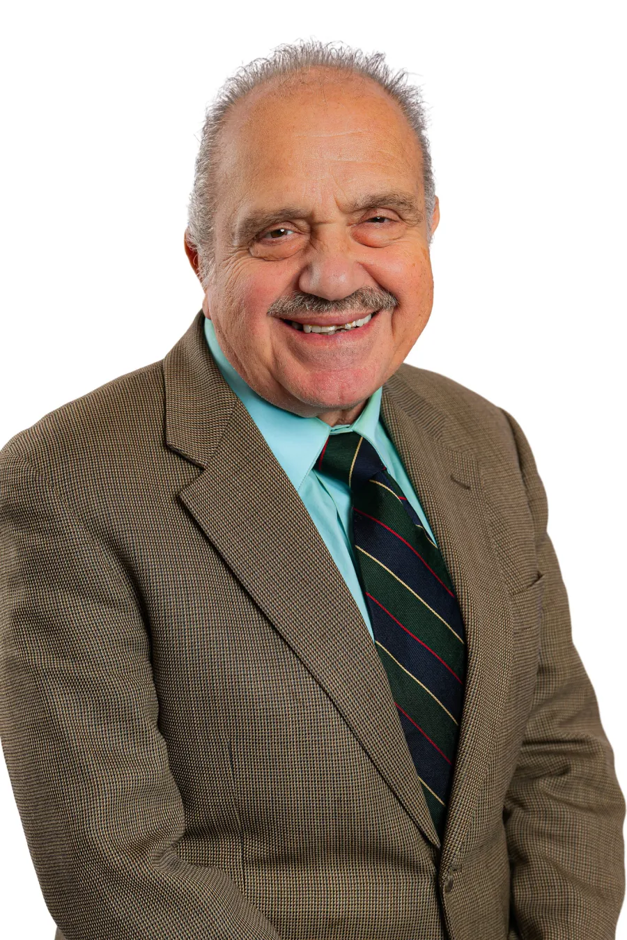 a man in a suit smiling
